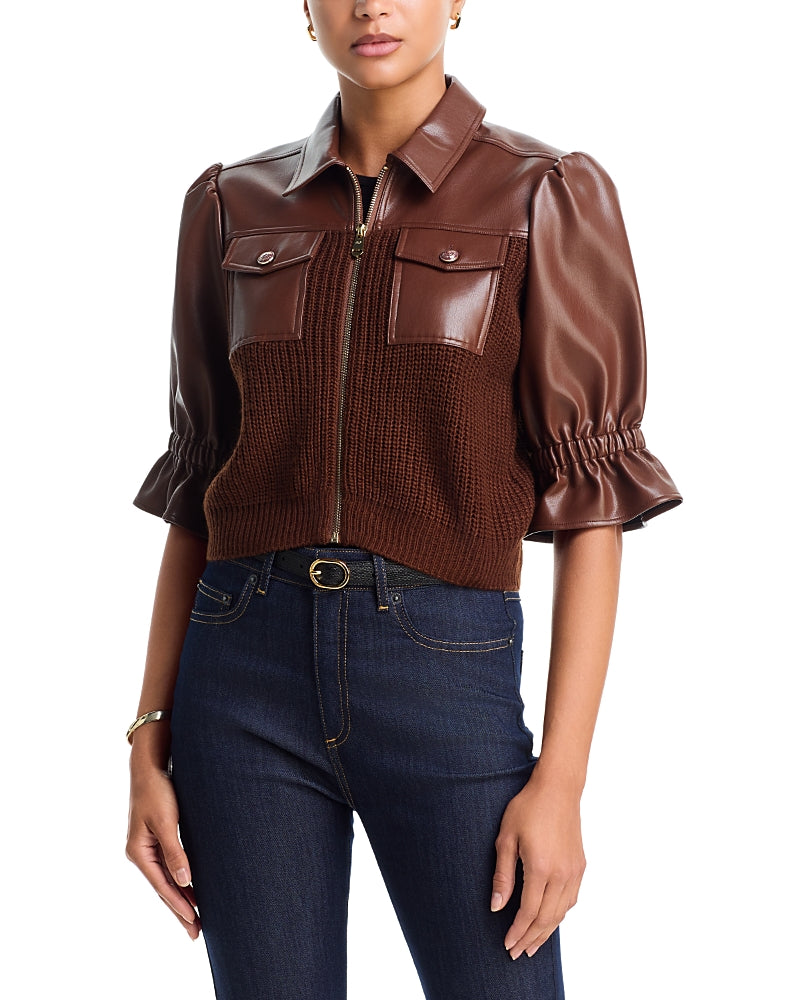Model wearing the Cinq à Sept Knit Holly Combo Jacket in Espresso brown featuring puff sleeves, front zip closure, and flap chest pockets.