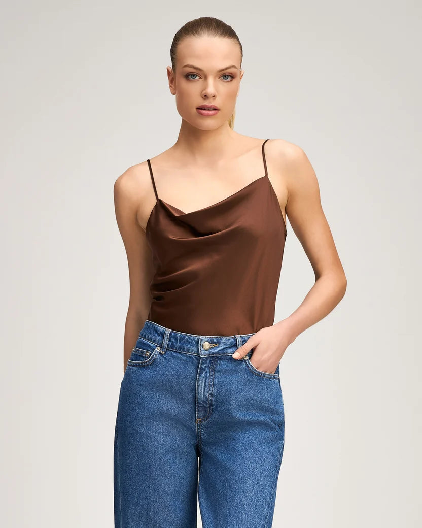 Woman wearing the Cinq à Sept Marta Cami in Espresso brown silk featuring a draped weighted cowl neckline and delicate spaghetti straps.