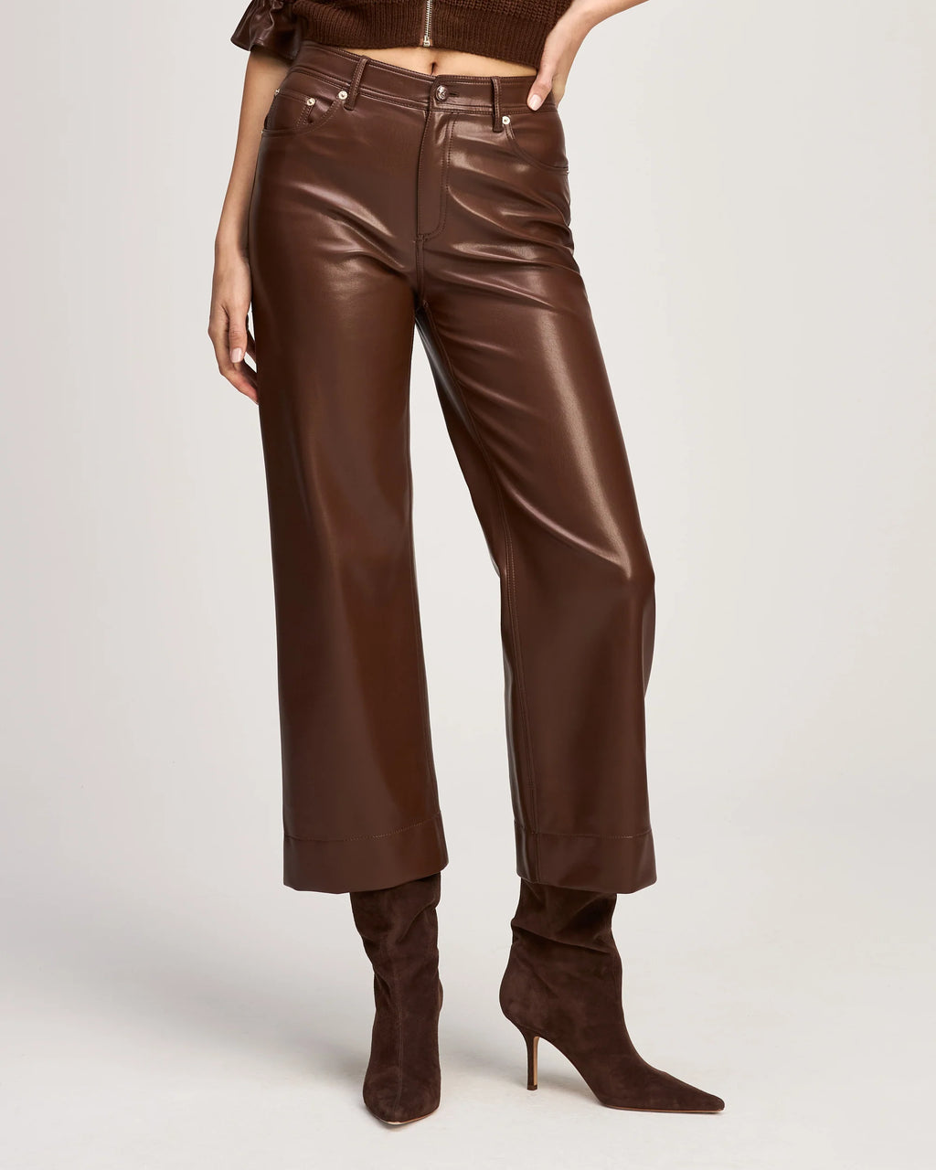 Full-length front view of a model showcasing the high-waisted fit and wide-leg silhouette of the Cinq à Sept Joey vegan leather pant.